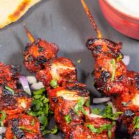 Lamb Tikka · Pieces of lamb marinated in yogurt, herbs and spices and broiled in a tandoori oven.