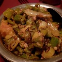 Bhindi Masala · Fried okra with chopped onions, tomatoes and spices. Vegan.