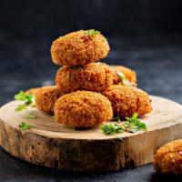 Falafel (6 Pcs) · Our homemade, crispy, fried falafel made with chickpeas and our blend of herbs and spices.