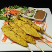 11 - Chicken Satay · Chicken marinated in coconut milk and Thai herbs skewered and grilled, served with peanut sa...