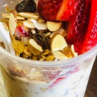 Strawberries & Cream · Topped with granola, rice puffs, raisins, almonds and coconut