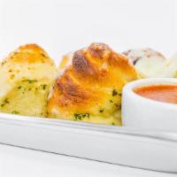 Garlic Knots · 5 garlic knots served with marinara.