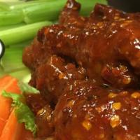 Chicken Wings · Un-breaded chicken wings fried and tossed in your choice of sauce. Served with celery and ca...