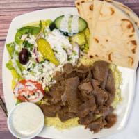 Gyros Plate · Thinly sliced blend of beef and lamb cooked on a vertical rotisseri.
