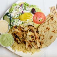 Chicken Shawerma Plate · Curry-based marinated chicken breast charbroiled and served with hummus and cilantro aioli.