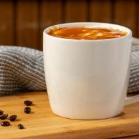 Caramel Macchiato · Freshly steamed milk with vanilla-flavored syrup is marked with espresso and topped with car...