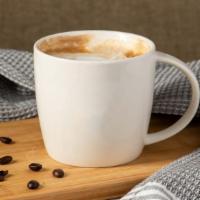 Cappuccino · Dark, rich espresso lies in wait under a smoothed and stretched layer of thick foam. It's tr...