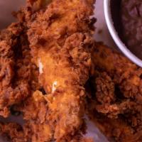 Chicken Tenders · Four chicken tenders fried or grilled, with a side of your choice and a piece of texas.