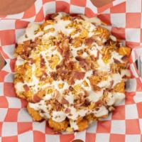 Loaded Tater Tots · Tater tots loaded with ranch, chives, cheddar jack cheese and bacon!