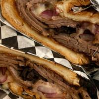 The Beefeater · Thinly sliced roast beef topped with grilled onions and swiss cheese on a French roll. Serve...