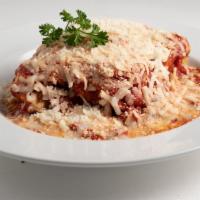 Lasagna Dinner With Salad · Layers of lasagna with sausage, mozzarella, ricotta, Romano, and Parmesan cheeses mixed with...
