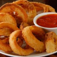 Onion Rings · Basket of fresh gourmet onion rings deep-fried.