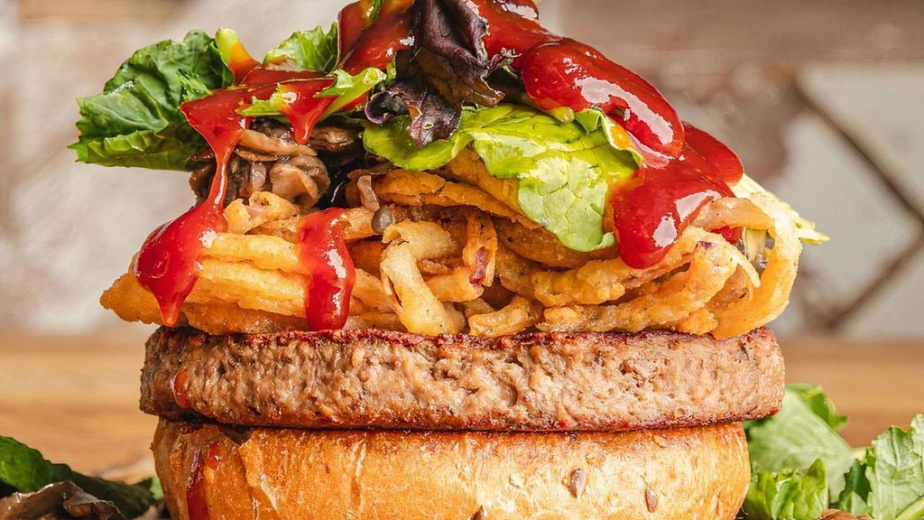 Veggie Burger · Juicy burger made with black bean patty, sliced avocado, chipotle mayonnaise, fresh lettuce, tomatoes, and onions with a choice of side.