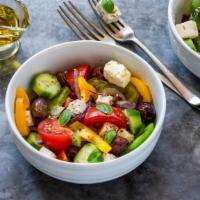 Greek Salad · Fresh salad made with Romaine lettuce, feta cheese, stuffed grape leaves, tomatoes, red onio...