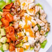 The Cobb Salad · Fresh salad made with roasted turkey breast, crispy bacon, avocado, chopped tomatoes, blue c...