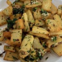 Battata Harra · Spicy diced potatoes sautéed with garlic, cilantro, and lemon juice.