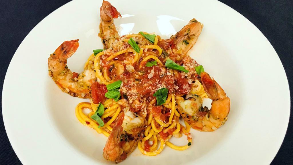 Spicy Wild Shrimp Pomodoro · 730 cal. rosemary garlic shrimp, spaghetti alla chitarra, roasted garlic tomato sauce, basil, parmesan cheese.