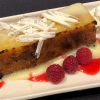 White Chocolate Bread Pudding · white chocolate and raspberry sauces, fresh raspberries, whipped cream