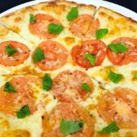 Margherita Pizza · 850 cal. Roma tomatoes, garlic oil, basil, mozzarella, parmesan and aged provolone cheese.