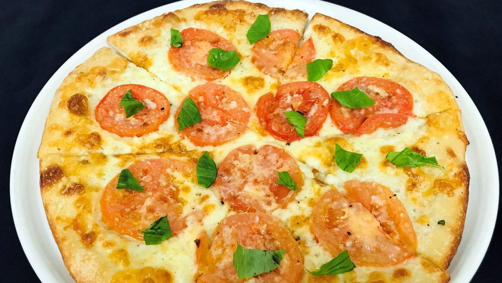Margherita Pizza · Roma tomatoes, garlic oil, basil, mozzarella, parmesan and aged provolone cheese.