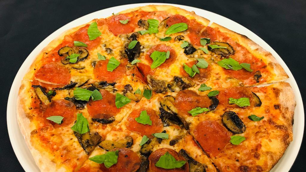 Pepperoni & Mushroom Pizza · marinated oyster mushrooms, pepperoni, roasted garlic tomato sauce, mozzarella cheese, fresh oregano