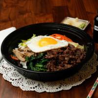Bibimbap · With spicy savory gochujang sauce. Six seasoned vegetables topped with a beef fried egg.