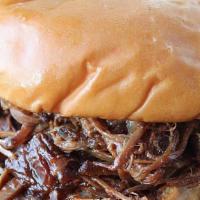 Brisket - Sandwich · Brandt Beef brisket slow smoked all day, hand shredded and  piled high on a soft Roll