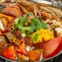Signature Beef Hot Pot · Angus beef, fish cake, tempura, imitation crab stick, pork sausage, luncheon meat, corn, tof...