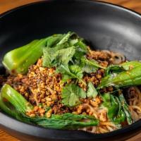 Dan Dan Noodles · Spicy and peanut. Ground pork, sweet soybean sauce, baby bok choy, chili oil, and crush pean...