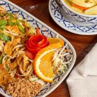 Pad Thai · Thai rice noodle, stir-fried with egg, chicken, carrot, bean sprout and green onion, topped ...