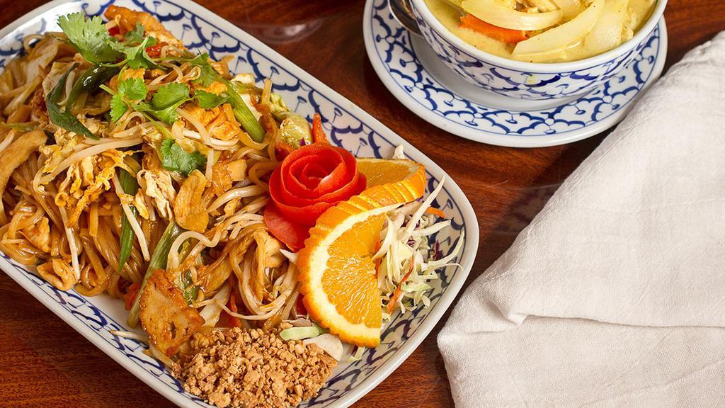 Pad Thai · Thai rice noodle, stir-fried with egg, chicken, carrot, bean sprout and green onion, topped with ground peanut.