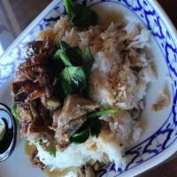 Kao Nar Ped (Roasted Duck Over Rice) · Roasted duck and spinach served with pickled chili in home-made soy sauce.