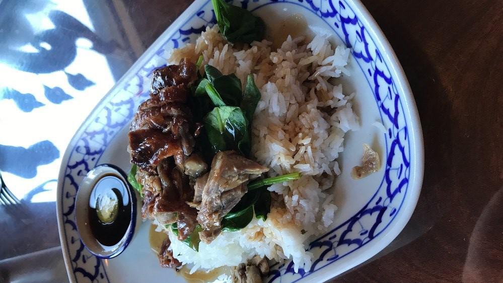 Kao Nar Ped (Roasted Duck Over Rice) · Roasted duck and spinach served with pickled chili in home-made soy sauce.