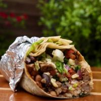 Steak Burrito · Steak wrapped in a warm flour tortilla with rice, beans, or fajita veggies, and topped with ...