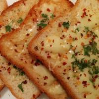 Gar-Lick That Cheese Bread · (Vegetarian) Housemade bread toasted and garnished with butter, garlic, mozzarella cheese, a...