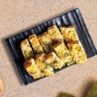 Gushing On Garlic Bread · (Vegetarian) Housemade bread toasted and garnished with butter, garlic, and parsley.