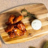 Wingstorm · Fresh chicken wings breaded and fried until golden brown. Served with a side of ranch or ble...