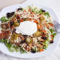 Mexican Chicken Salad · Mexican chunks of chicken breast grilled with salsa, served over a bed of mixed cabbage and ...