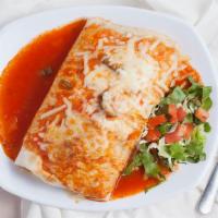 Super Burrito Ranchero · Has everything our delicious super burrito has except its generously covered in a rich and t...