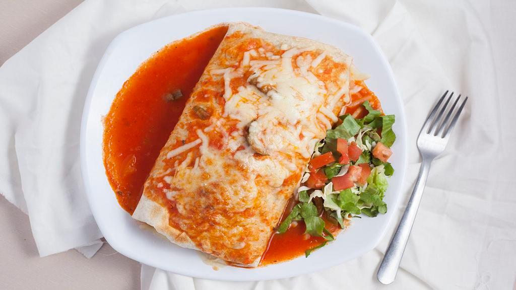 Super Burrito Ranchero · Has everything our delicious super burrito has except its generously covered in a rich and tasty ranchero sauce.