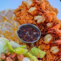 Camarones Al Mojo De Ajo · Large shrimp sauteed in butter, fresh garlic, and spices. Served with rice and beans.