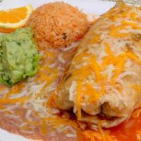 Champion Burrito · Chile relleno, grilled steak, rice and beans rolled in a large flour tortilla topped with ra...
