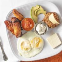 Desayuno Salvadoreno Breakfast · Servido con casamiento, crema, queso, aguacate and platano Fritos y huevos rancheros.