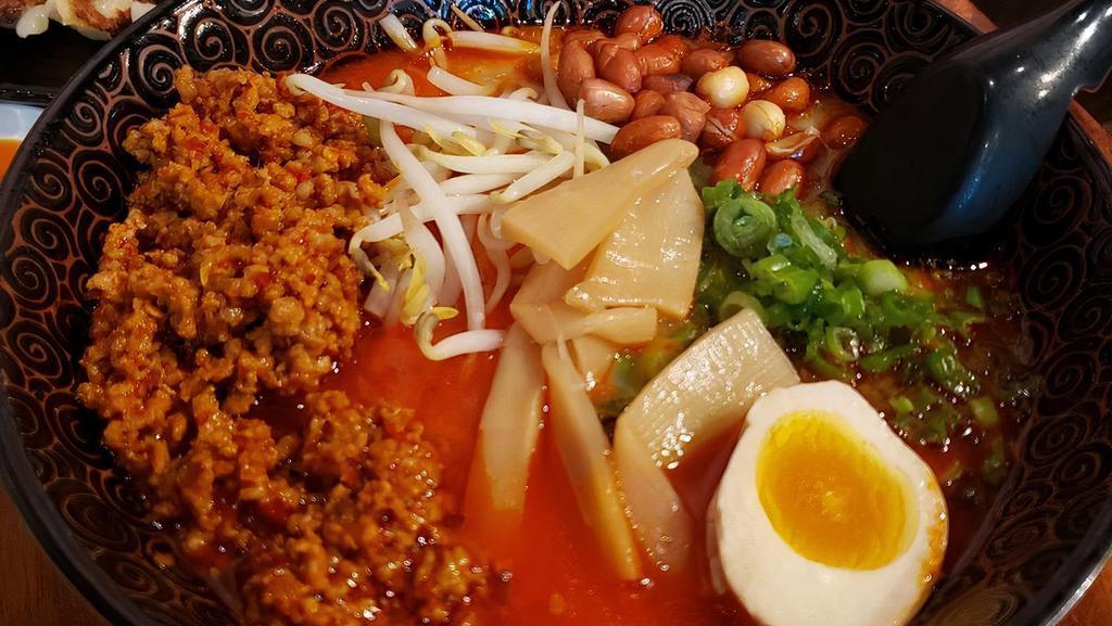Spicy Pork Ramen · Thick Noodle, spicy pork, peanuts, green onion, corn, Bean Sprouts, bamboo, egg, tonkotsu soup.