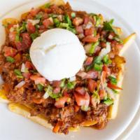 Irish Nachos · French fries topped with seasoned ground beef, melted cheddar cheese, sour cream, and pico d...
