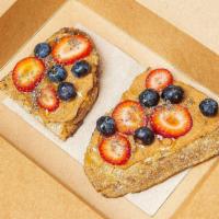 Almond Butter Toast · Organic, multi-grain toast (Gluten-Reduced) spread with raw almond butter and choice of topp...