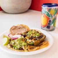 Tacos · Choice of meat, onion, cilantro, cabbage, salsa, guacamole.