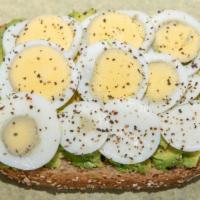 Avocado Toast · Open faced sandwich on wheat toasted bread made with avocado, sliced fresh hard boiled egg g...