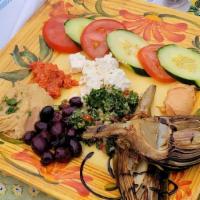 Mezza · Combination appetizers plate with humus, feta cheese, olives, artichoke, sun-dried tomatoes,...