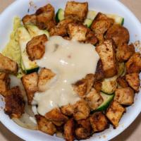 Chicken Bowl · Tender pieces of grilled meat and vegetables over rice pilaf. served with garlic sauce.